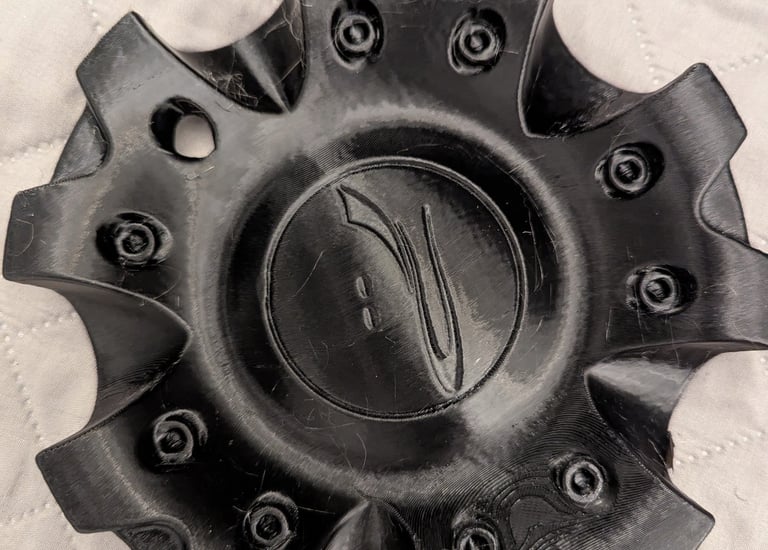 black 3d printed car wheel disc cap with logo