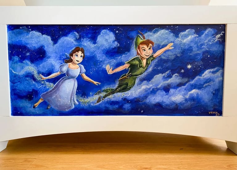 Toy chest hand-painted with whimsical characters and a midnight blue, starry sky."