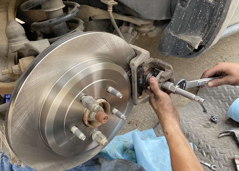 Image of our technician installing brand new brakes