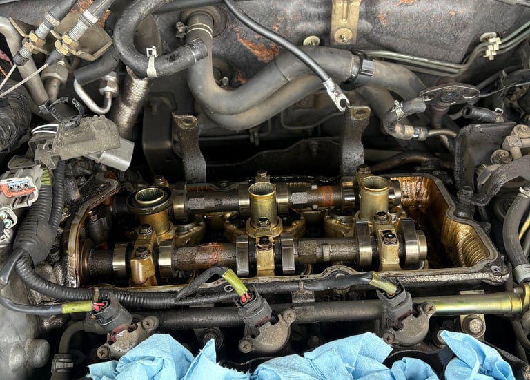 Image of a rear valve cover removed on a nissan maxima