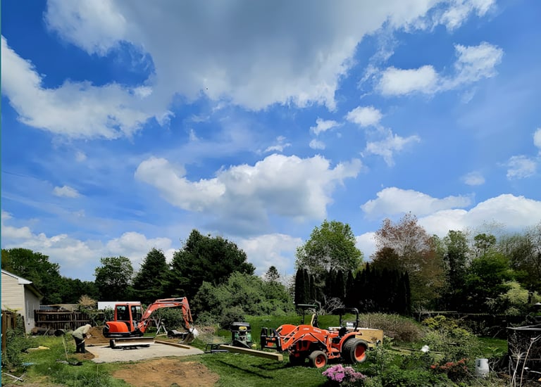 a tractor with a tractor trailer parked in a field