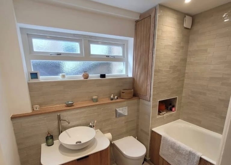 Beige and White Bathroom refurbishment by Roman Refurbs in Cheshunt UK