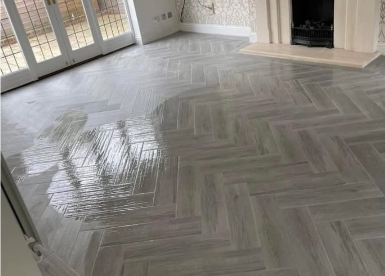 Herringbone grey floor tiling by Roman Refurbs in Cheshunt tiling experts in UK