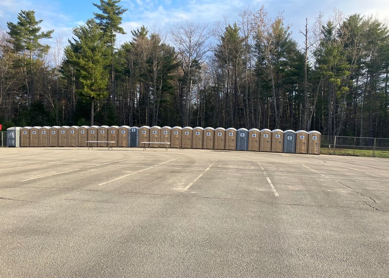 portable potties in a parking lot