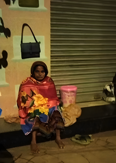 a woman sitting on a bench in front of a building