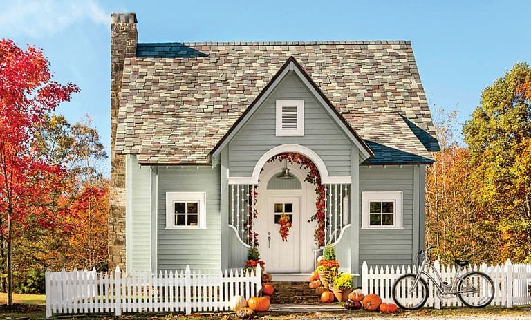 Image of home with white picket fence