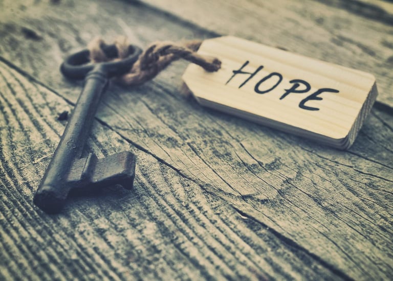 Image of a key with the a tag that reads HOPE