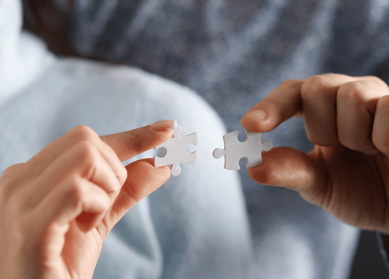 nlp as two persons holding a puzzle piece of puzzle pieces to fit together