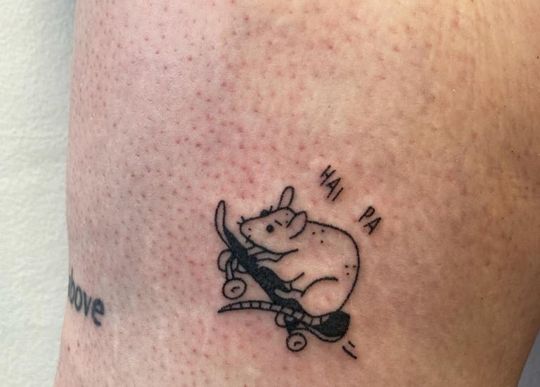 a tattoo of a mouse on the side of a person's leg made at Inari Tattoo