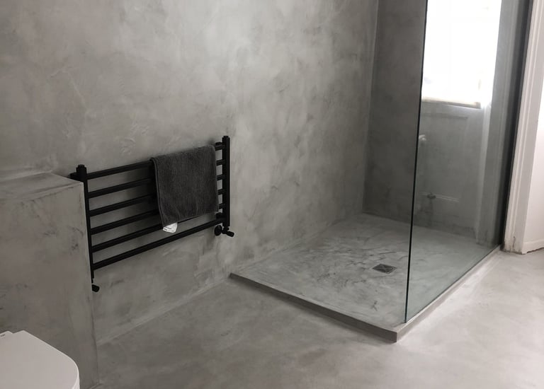 Textured plaster bathroom walls and concrete-effect finish, completed by Pure Perfection on Dulwich