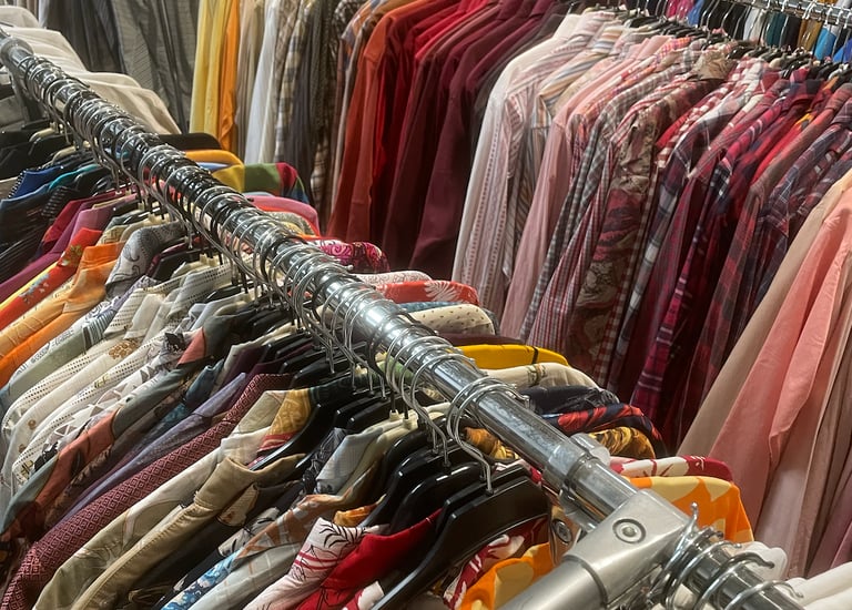 a rack of clothes and clothes hanging on a rack
