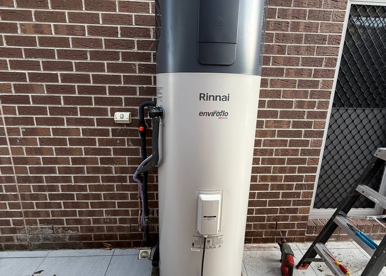 a water heater sitting on a sidewalk
