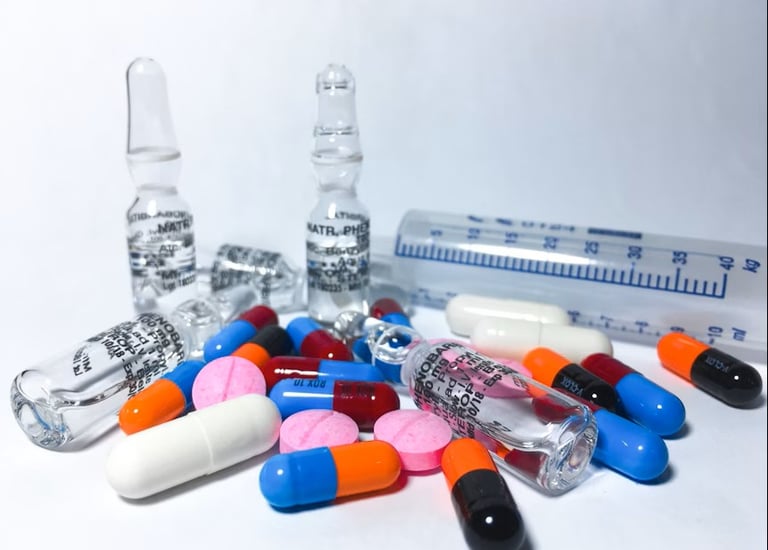 A collection of various pills and capsules, including a prominent green gel capsule and a heart-shap