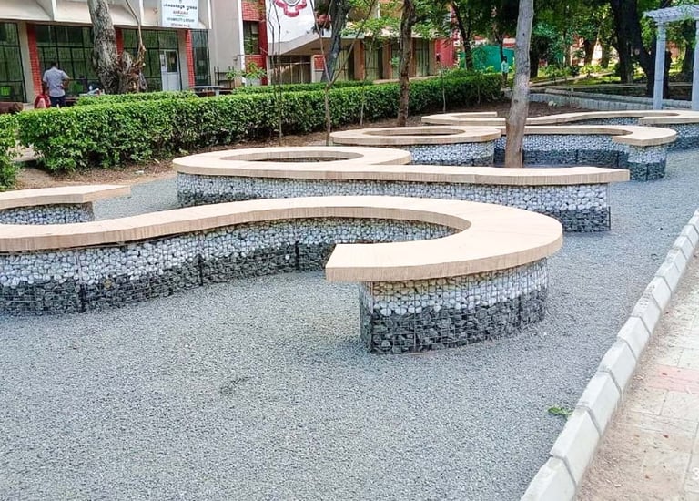 Institutional garden with shaded walkways and educational green zones by Garden Designers