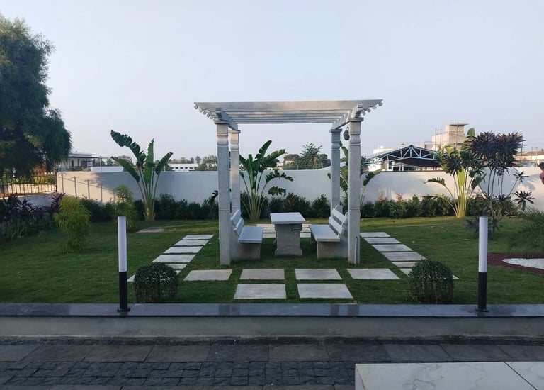 Pathway designed with natural stone slabs and edging by Garden Designers