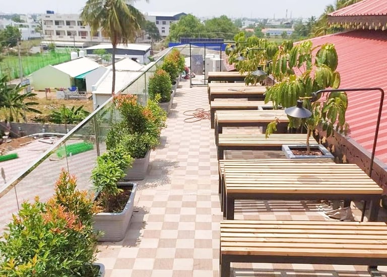 Lush rooftop terrace landscape with shade and ornamental greens by Garden Designers