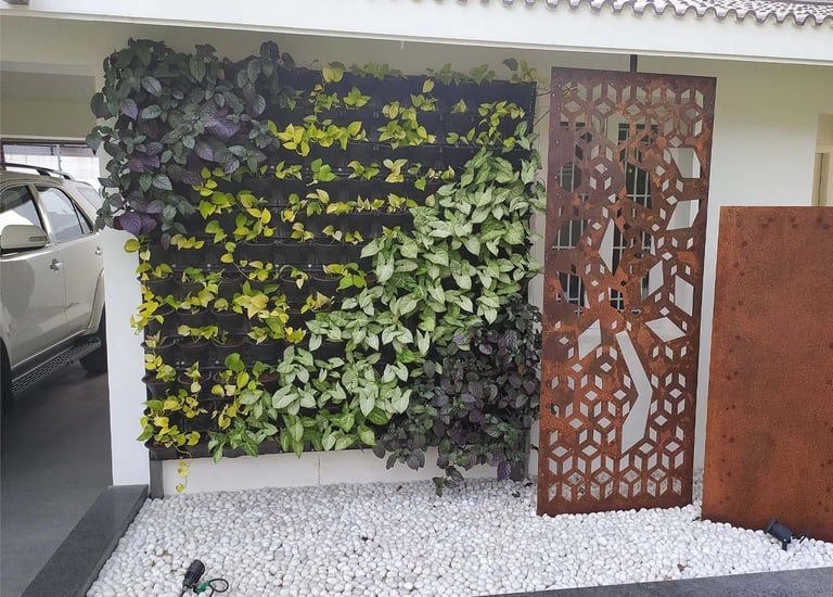 Fresh and vibrant vertical garden installation on a wall by Garden Designers