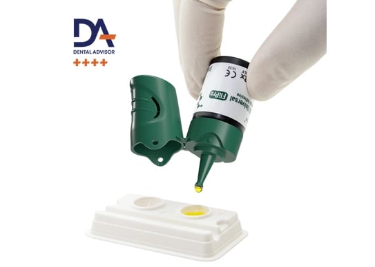 a person in gloves and gloves is holding a bottle of liquid