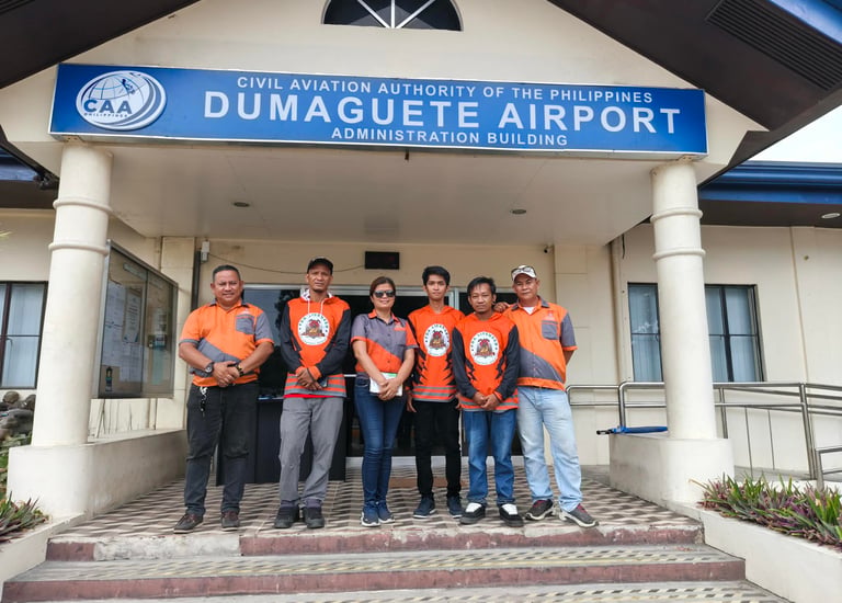 Jansen Pest Control posing at Dumaguete Airport Administration Building in the Philippines.