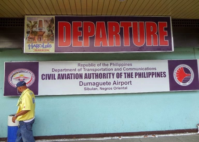 Departure entrance sign at Dumaguete Airport in Sibulan, Negros Oriental, Philippines.