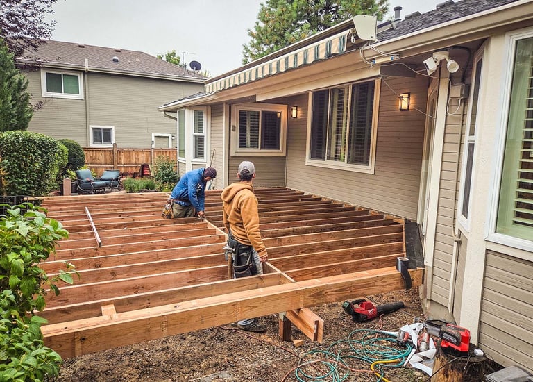 Custom deck framing project behind a home in Lakewood CO