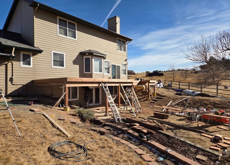 Structural deck framing and beam installation for a residential rebuild by Elk Valley Contractors.