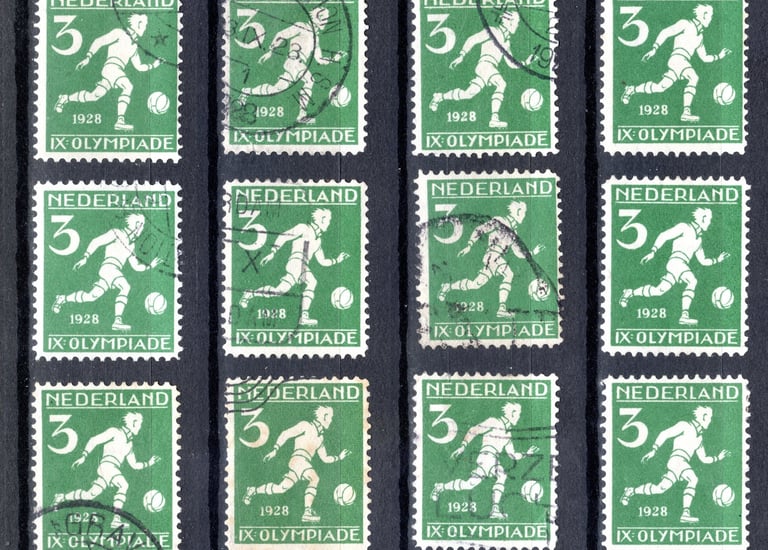 a group of stamps with a soccer player on it