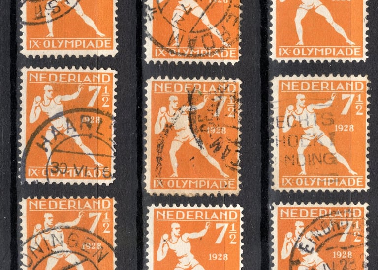 a collection of stamps stamps with a picture of a man in a baseball uniform