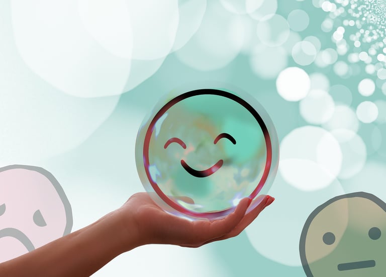 a person holding a smiley face in front of a blue background