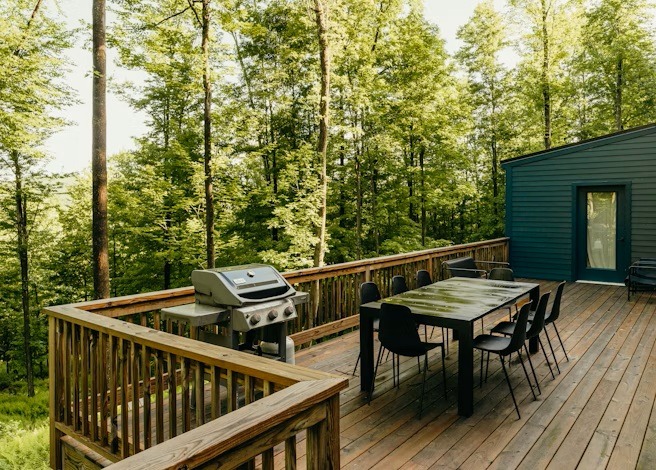 a deck with a table and chairs