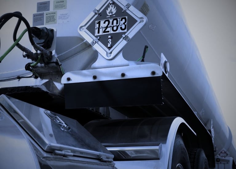 "DOT hazmat truck with 1203 gasoline placard for flammable liquid transportation"