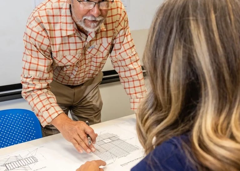 Alberto reviewing project with client