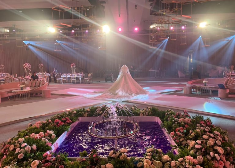 a wedding ceremony with a fountain fountain in the center of the room