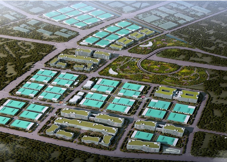 Aerial view of a sustainable industrial park with green roofs and modern commercial buildings.
