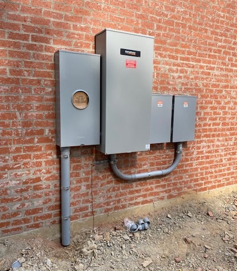 Exterior panel upgrade with transfer switch for future whole-home generator.