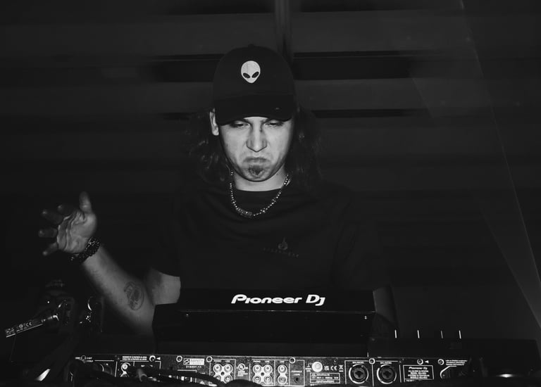 a man in a black shirt and a hat