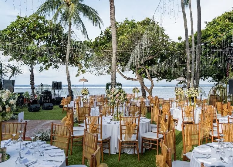 Beach wedding decoration with white drapes and tropical flowers by Pune wedding planning experts