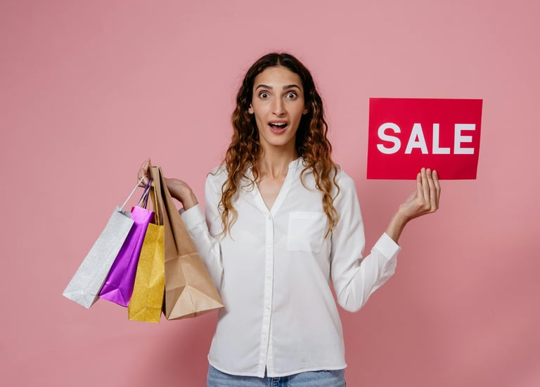 Shopper with bags and SALE sign