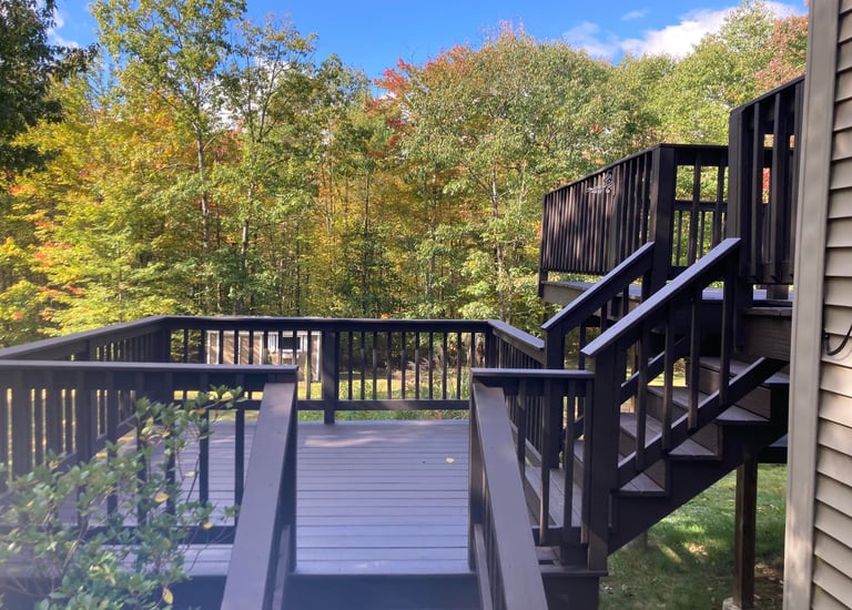 a staircase leading to a deck deck with a staircase
