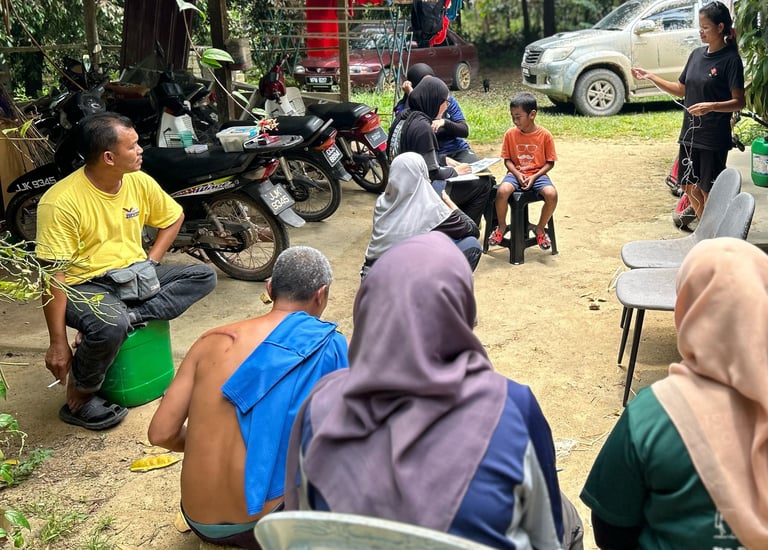 Environmental data collection through interview with Orang Asli community in Malaysian forest.