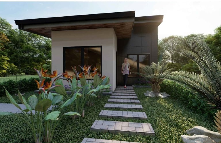 Diseño de casa pequeña moderna con techo plano, sendero de piedra y exuberante paisajismo tropical.