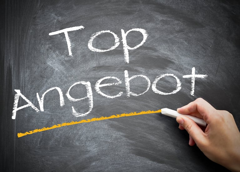 a person writing an angel foot on a chalkboard