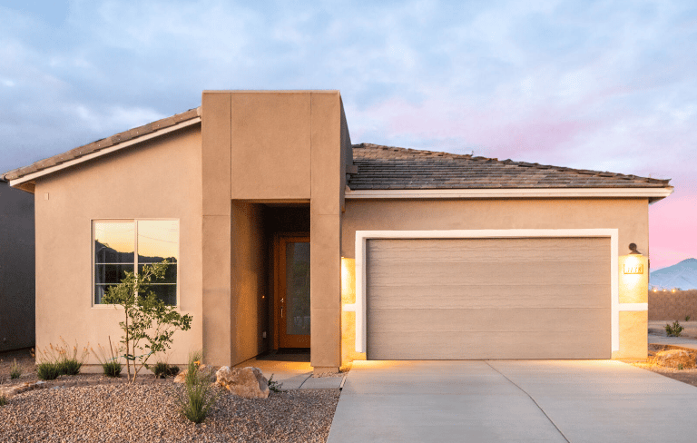 a house with a garage door and a driveway