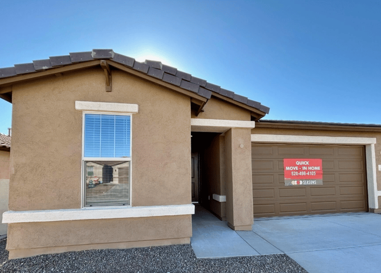 a house with a garage door and a garage door