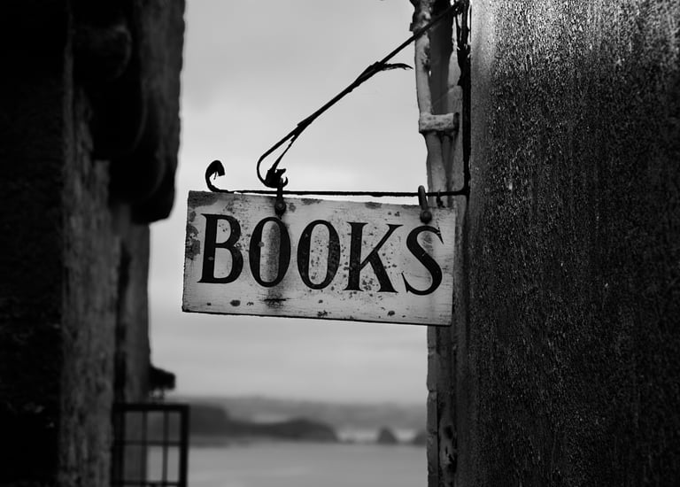a sign that says books on it on the side of a building