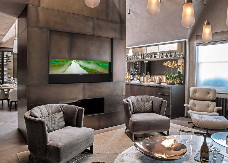 Large TV hidden behind a moving wall panel