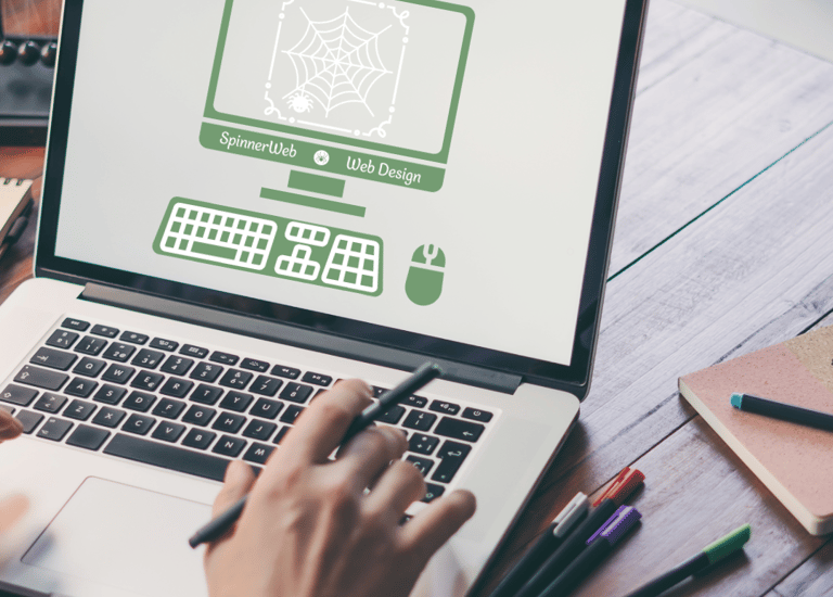 a laptop with a website designers logo on