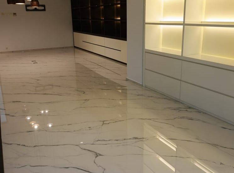 a room with a marble floor and a white marble floor