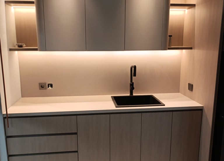 a kitchen with a sink and a refrigerator
