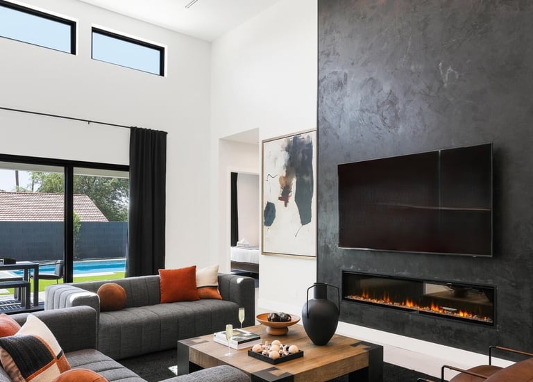 Modern Roman clay fireplace with a smooth, textured finish, creating a warm and sophisticated focal